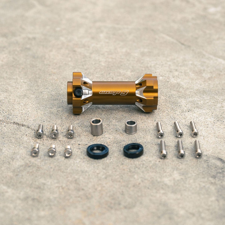 Warp 9 jackshaft kit in magnesium color with components, including bolts, seals, and distance tubes